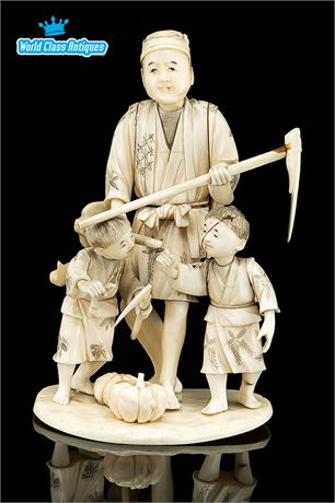 Large Antique Ivory Okimono Of A Farmer with 2 Children & Farm Tools